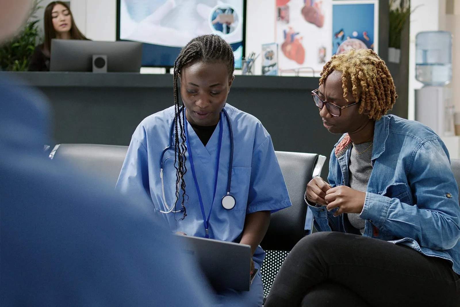 A nurse talking with a patient in a clinic